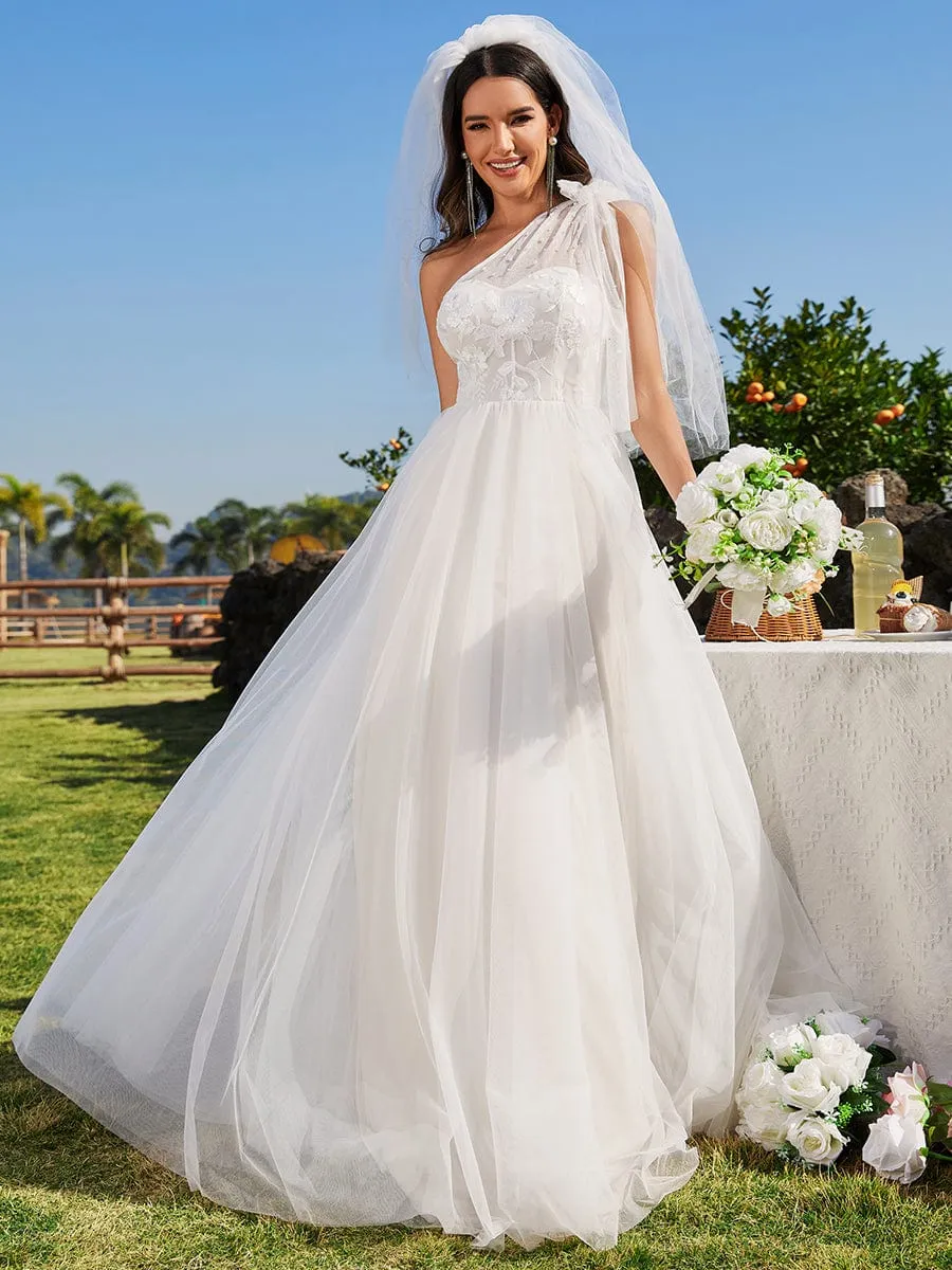 Asymmetric Printed Sleeveless Wedding Gown with Bow Detail